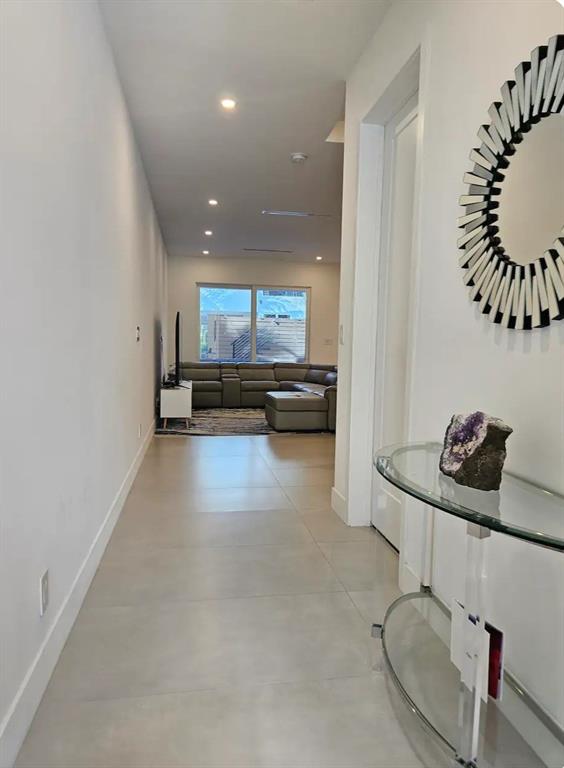 2275 Southeast 7th Street Pompano Beach, FL 33062 - Photo 9 of 14 a view of a kitchen with kitchen island stainless steel appliances a sink and a stove