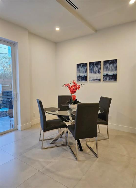 2275 Southeast 7th Street Pompano Beach, FL 33062 - Photo 10 of 14 a dining room with a table and chairs