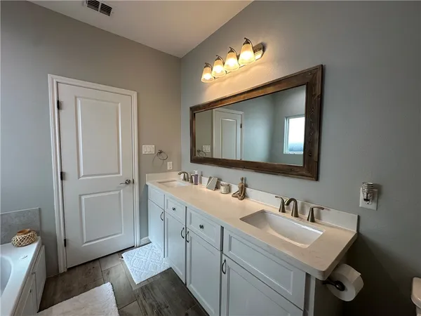 a bedroom with a bed and dresser