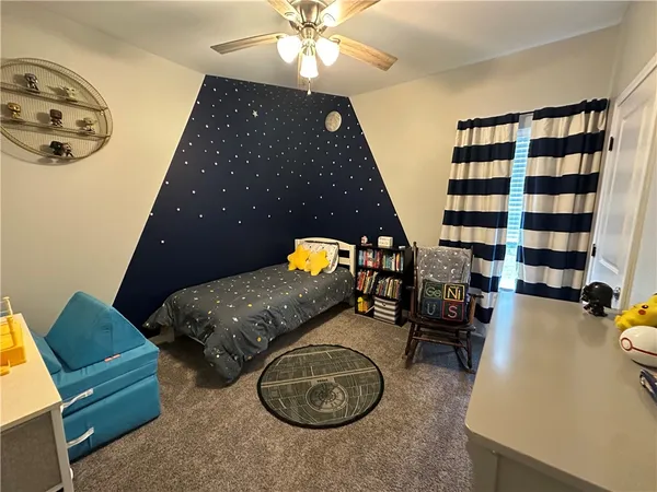 a bedroom with furniture and a chandelier
