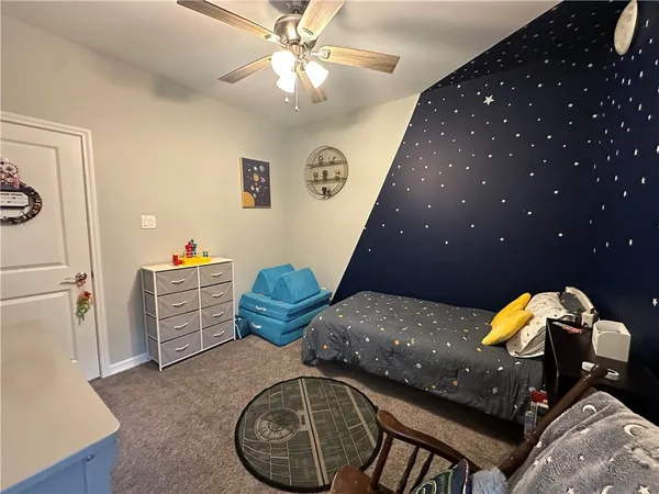 a room with furniture and gym equipment