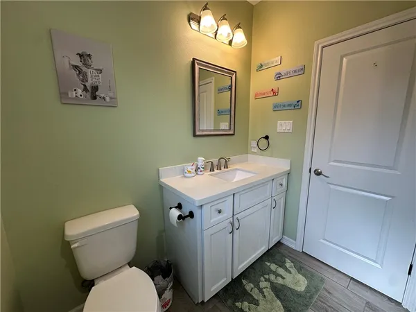 a white toilet sitting next to a shower curtain