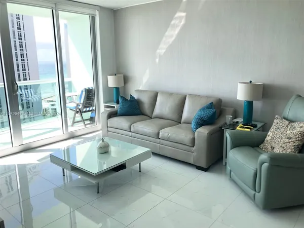 a living room with furniture and a window