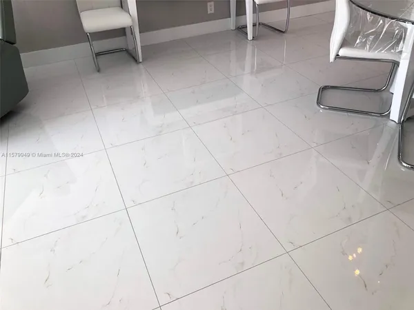 a kitchen with stainless steel appliances a refrigerator sink and microwave