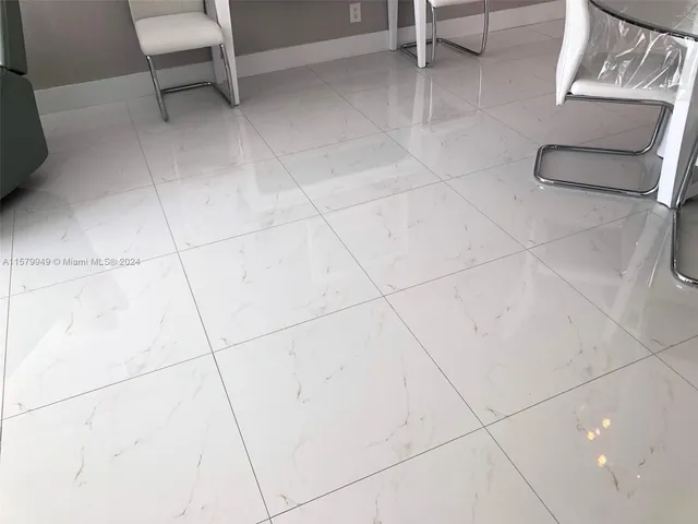 a kitchen with stainless steel appliances a refrigerator sink and microwave