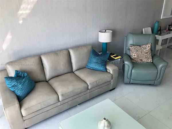 a bathroom with a sink a toilet and a shower