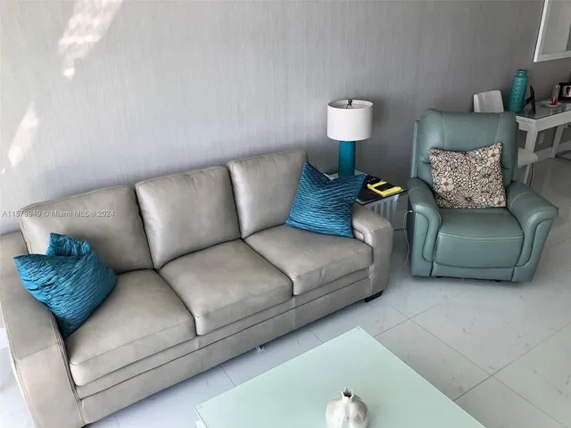 a bathroom with a sink a toilet and a shower