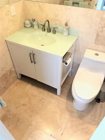 a view of swimming pool with table and chairs