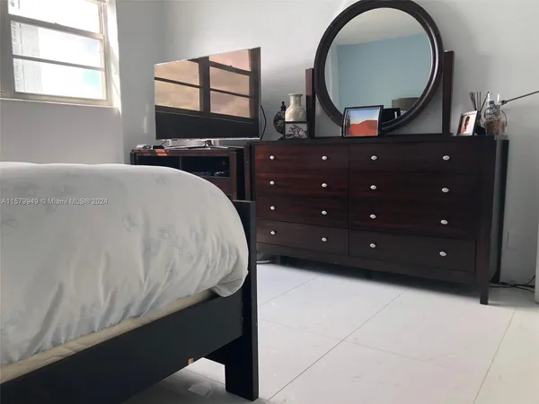 a lobby with furniture and a potted plant