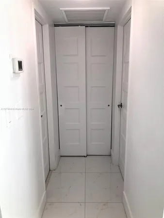 a view of a garden with a building in the background