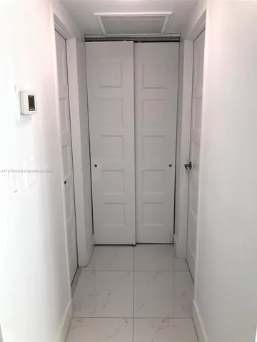 a view of a garden with a building in the background