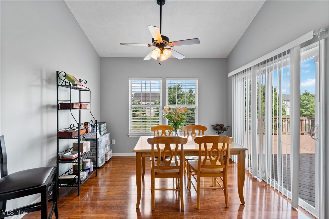 4467 Ridgestone Way Medina, OH 44256 - Photo 10 of 31 Dining space with ceiling fan, wood-type flooring, and vaulted ceiling