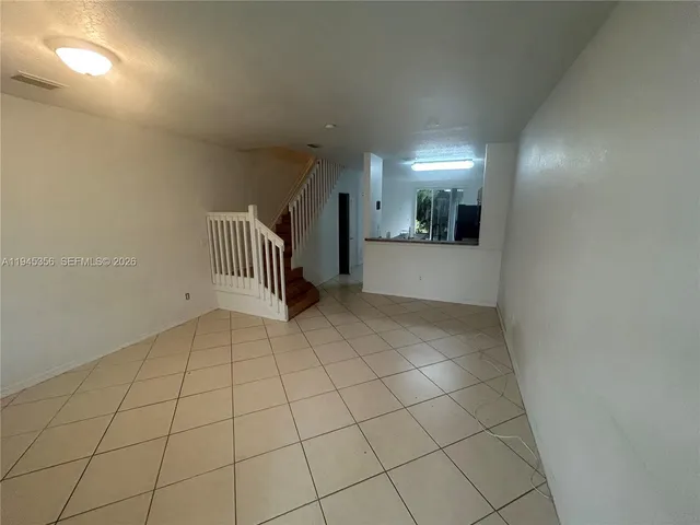 a view of hallway with wooden floor