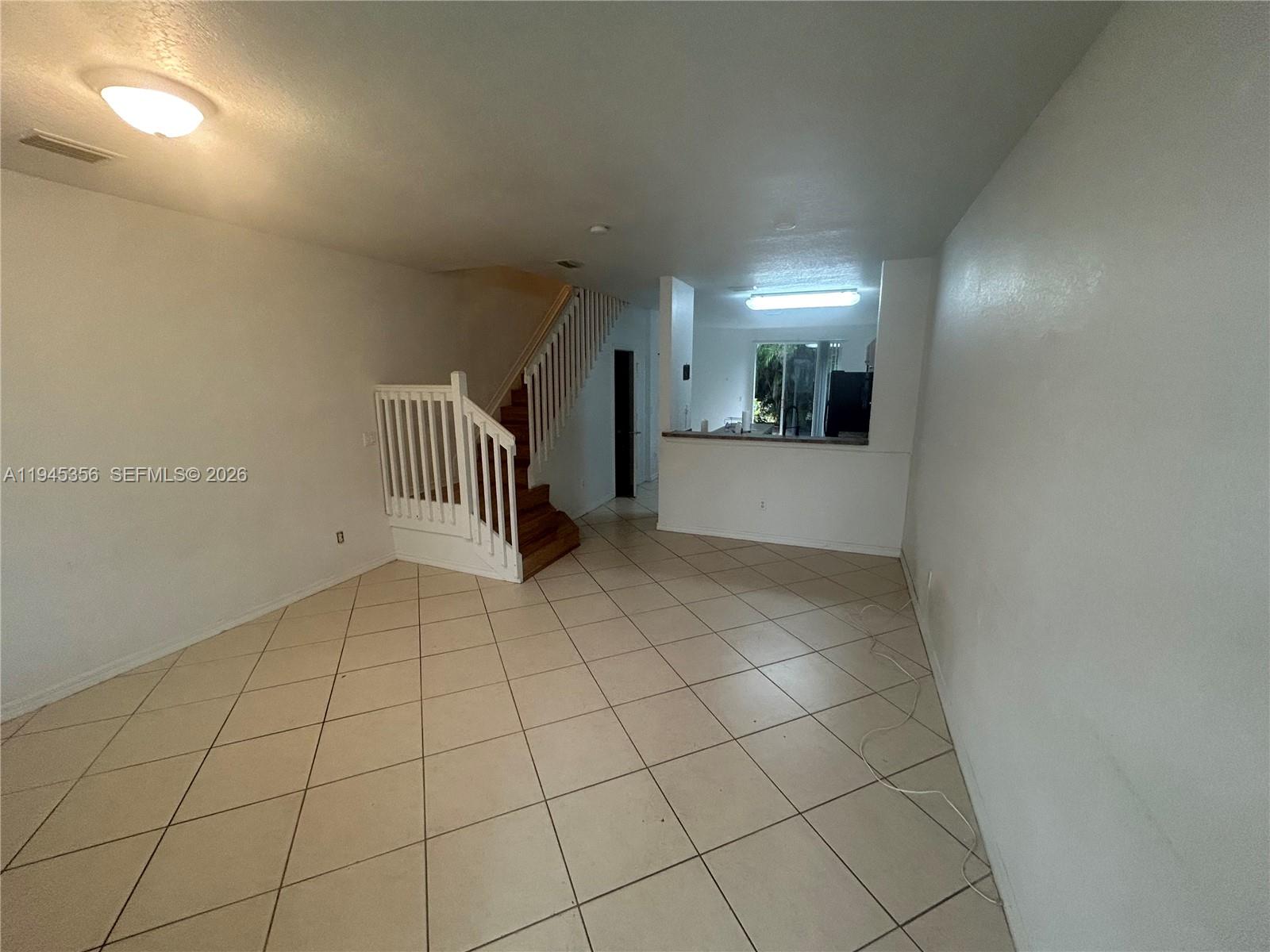 1916 Alamanda Way Riviera Beach, FL 33404 - Photo 15 of 22 a view of an empty room and window