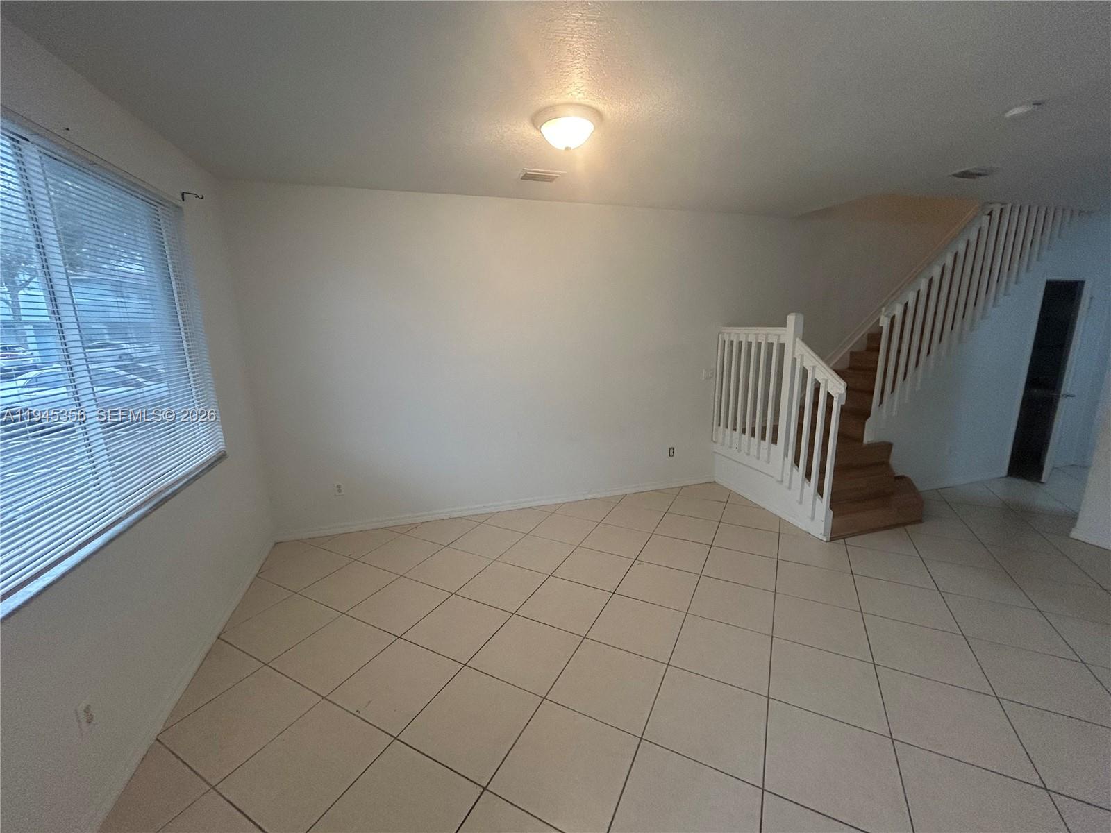 1916 Alamanda Way Riviera Beach, FL 33404 - Photo 18 of 22 an empty room with windows