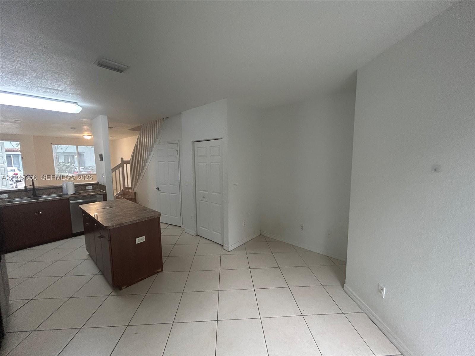 1916 Alamanda Way Riviera Beach, FL 33404 - Photo 10 of 22 a kitchen with a cabinets and counter space