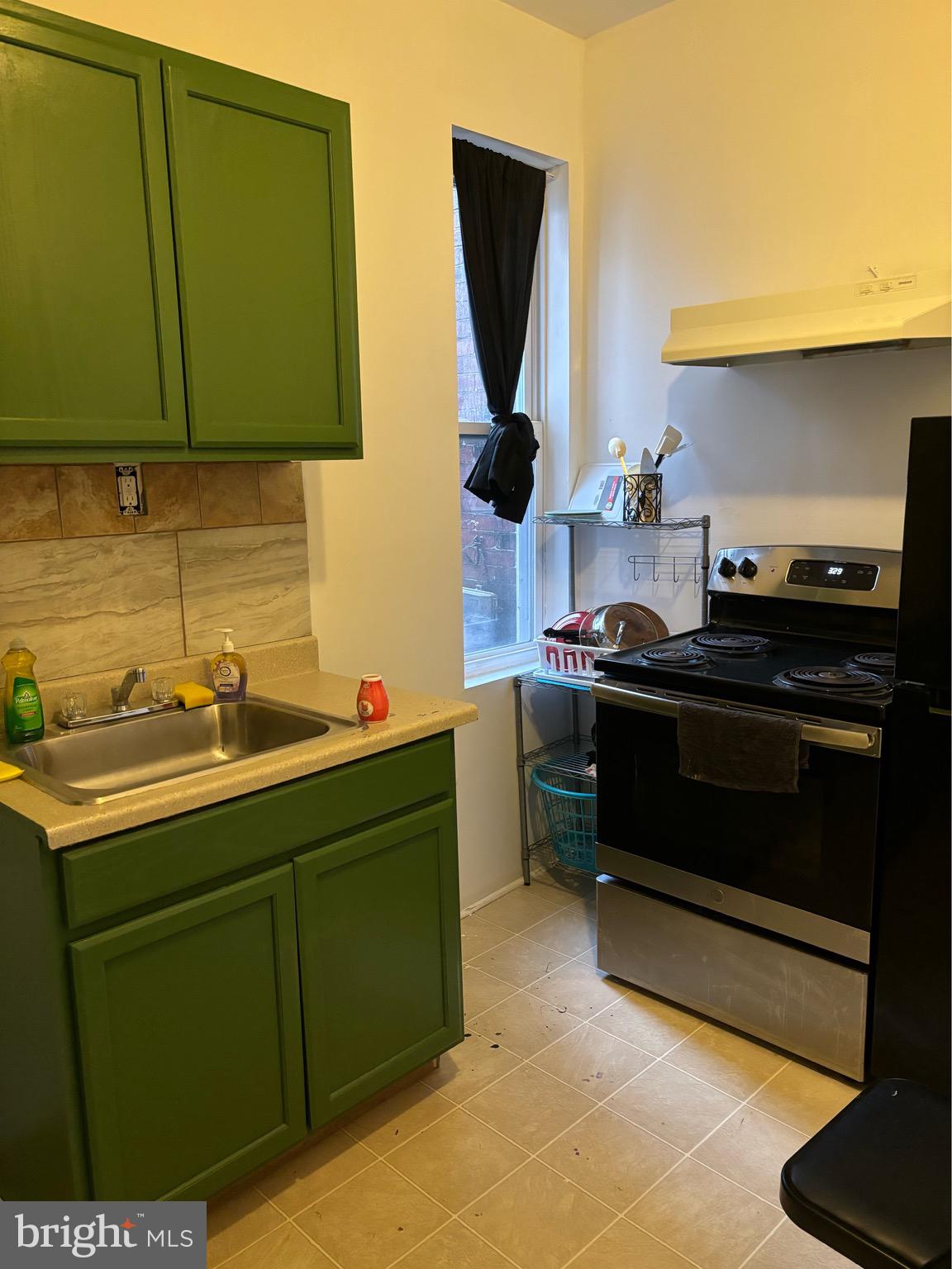 4328 Frankford Avenue, Unit 2A Philadelphia, PA 19124 - Photo 18 of 20 a kitchen with a sink and a stove