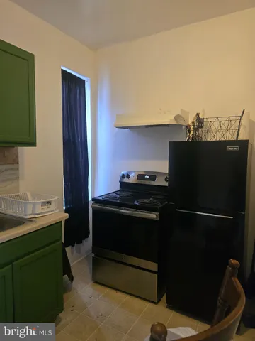 a kitchen with a sink and a stove