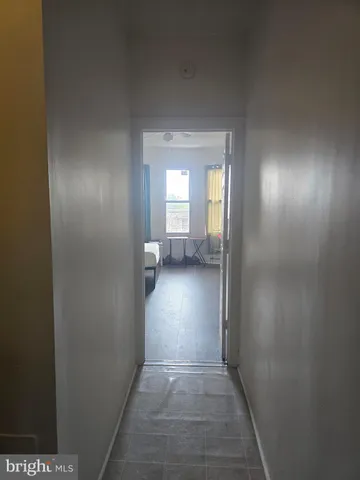 a view of a brick house with a backyard