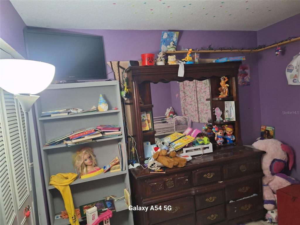 3762 Southwest 150th Loop Ocala, FL 34473 - Photo 14 of 25 a room with storage and utility