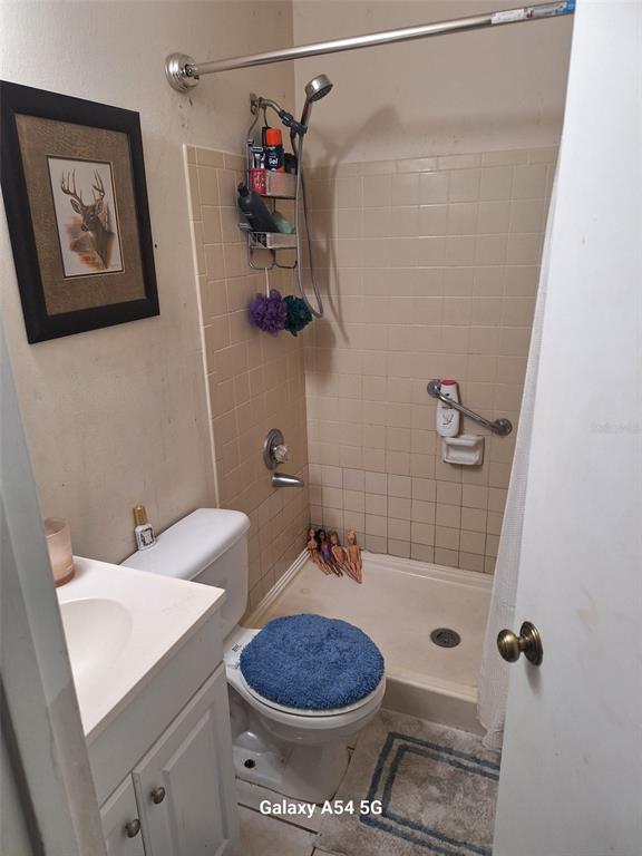 3762 Southwest 150th Loop Ocala, FL 34473 - Photo 9 of 25 a bathroom with a toilet and a shower