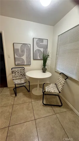 a living room with furniture and white walls