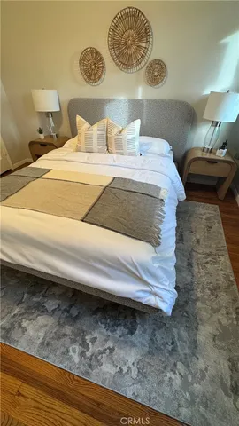 a bedroom with a bed and dresser