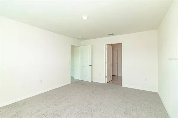 view of a bathroom with a shower and a sink