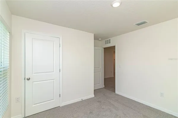 a view of a hallway with closet