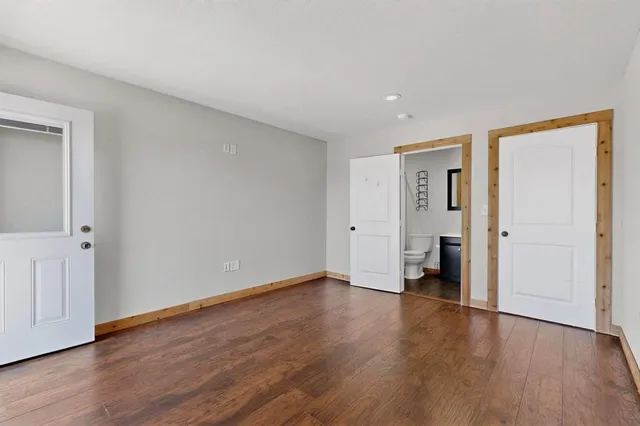 a bathroom with a sink a toilet and a shower curtain