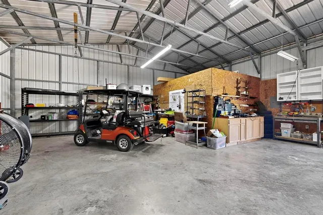 a view of parking garage with cars