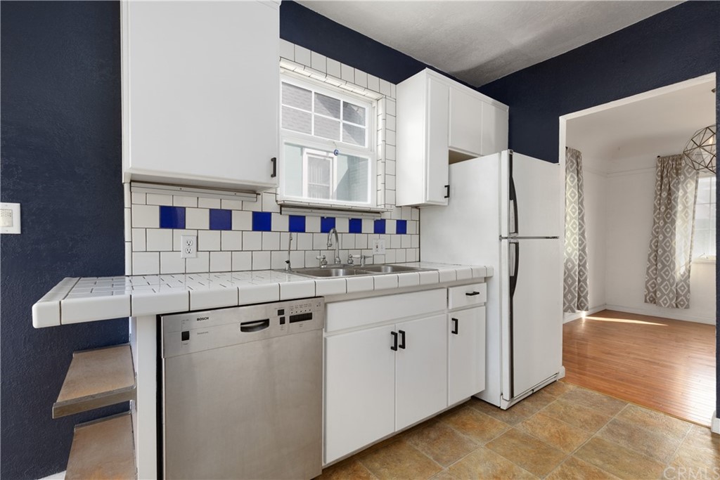 2537 Devonshire Lane Altadena, CA 91001 - Photo 11 of 23 a kitchen with stainless steel appliances a refrigerator and a cabinets