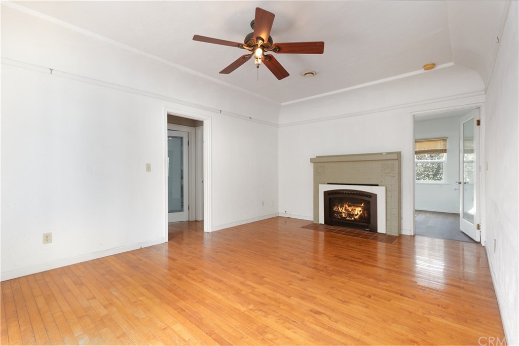2537 Devonshire Lane Altadena, CA 91001 - Photo 8 of 23 a view of empty room with wooden floor and fireplace