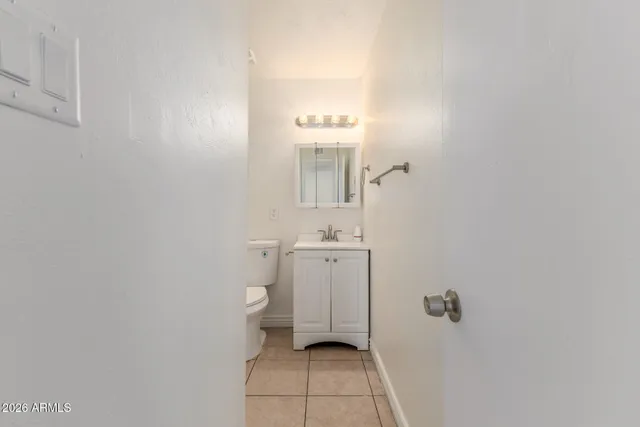 a bathroom with a sink toilet and vanity
