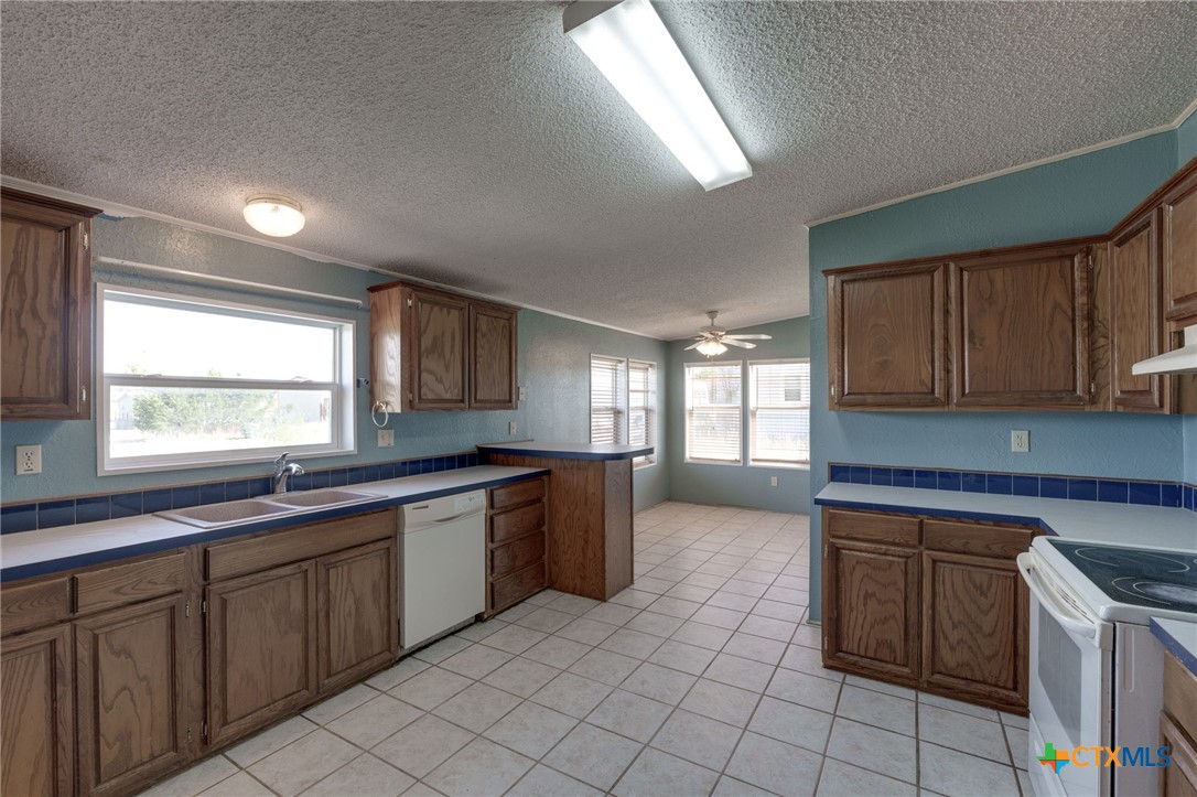 809 Crest Court Copperas Cove, TX 76522 - Photo 8 of 22 a large kitchen with a sink and cabinets