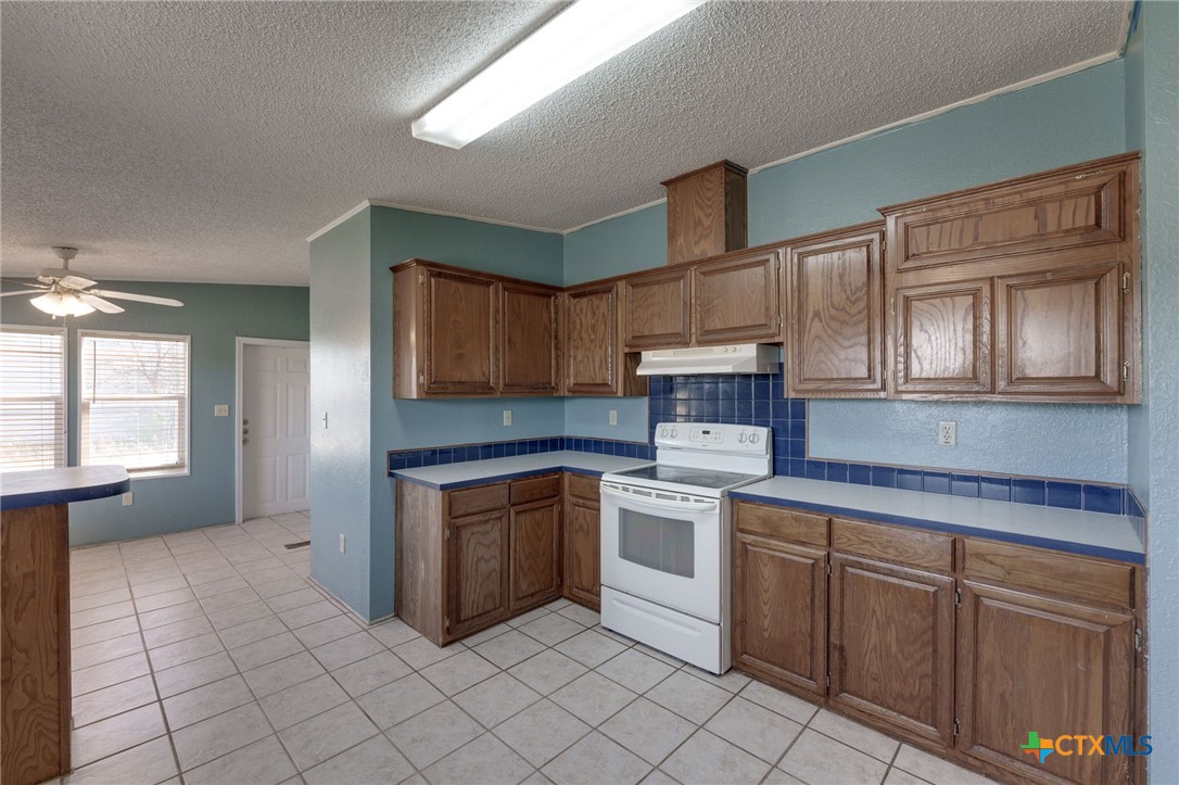 809 Crest Court Copperas Cove, TX 76522 - Photo 9 of 22 a kitchen with cabinets appliances and a window