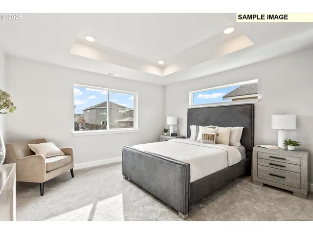 a bedroom with a bed and a couch