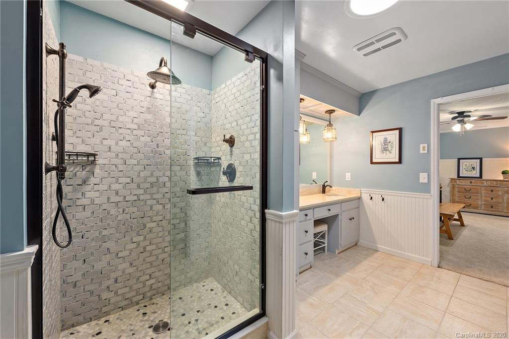 2087 Hough Road Lancaster, SC 29720 - Photo 14 of 27 a bathroom with a granite countertop shower a sink and a mirror