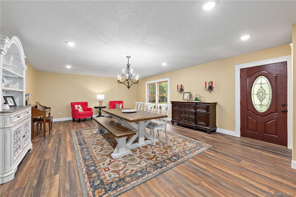 2087 Hough Road Lancaster, SC 29720 - Photo 3 of 27 a living room with furniture a fireplace and wooden floor