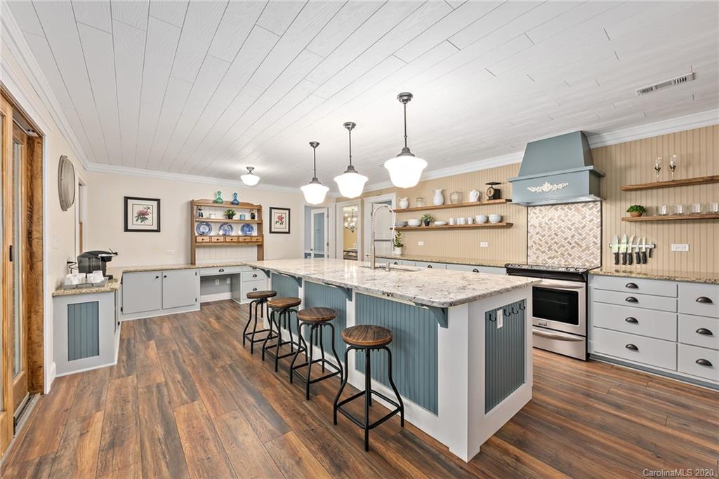 2087 Hough Road Lancaster, SC 29720 - Photo 8 of 27 a kitchen with stainless steel appliances granite countertop a stove oven and a refrigerator
