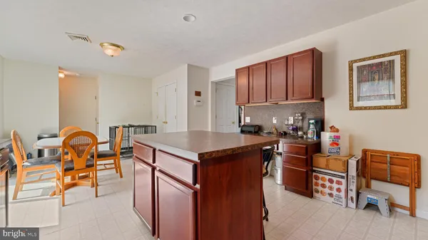 a kitchen with stainless steel appliances granite countertop a stove and a refrigerator