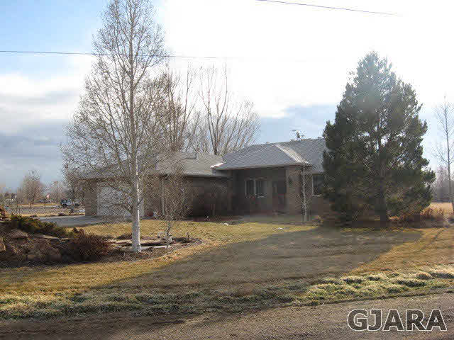 1705 K K 3/4 Road Fruita, CO 81521 - Photo 1 of 1 a view of a town with large tree