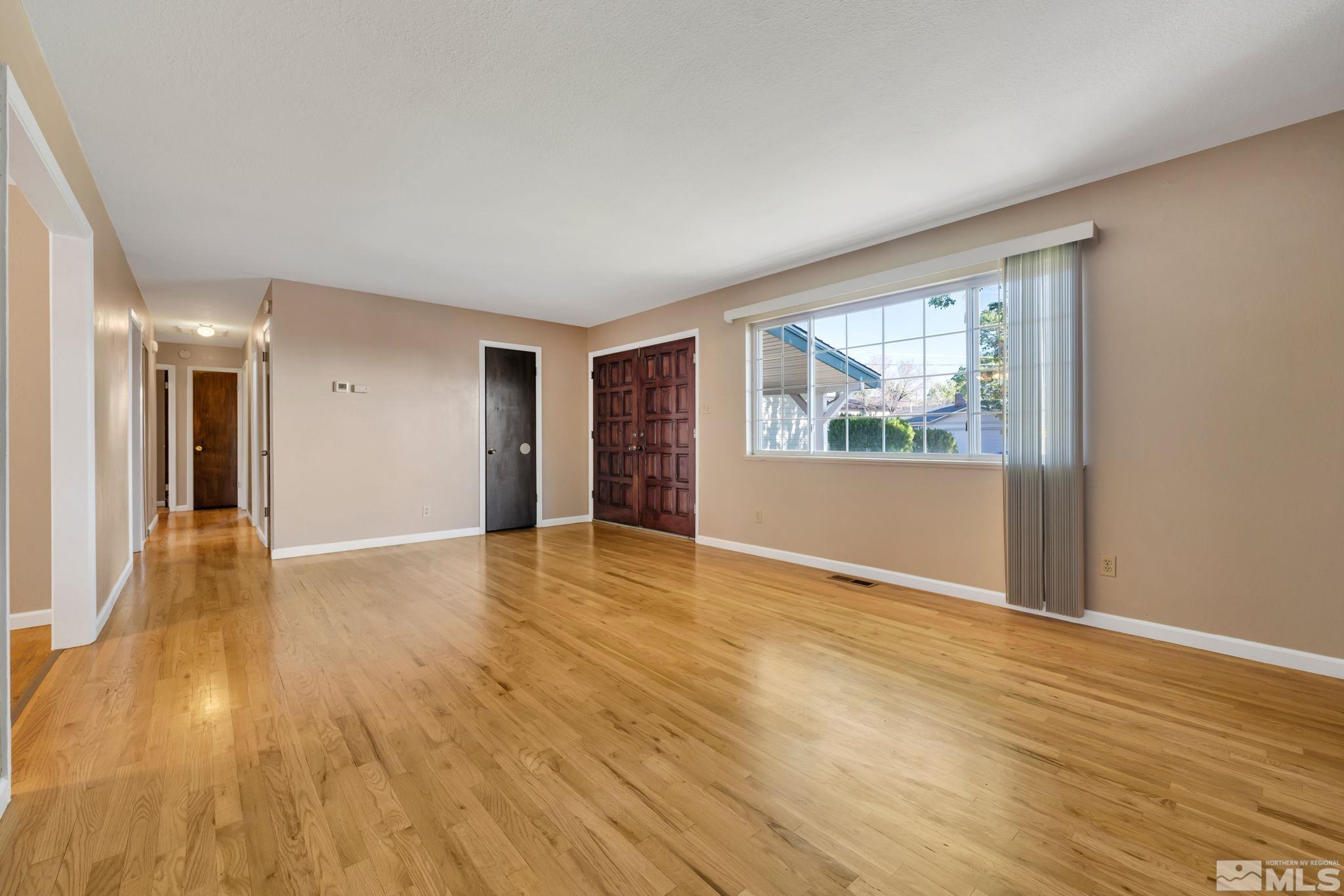 3240 Kings Row Reno, NV 89503 - Photo 12 of 31 a view of empty room with wooden floor and fan