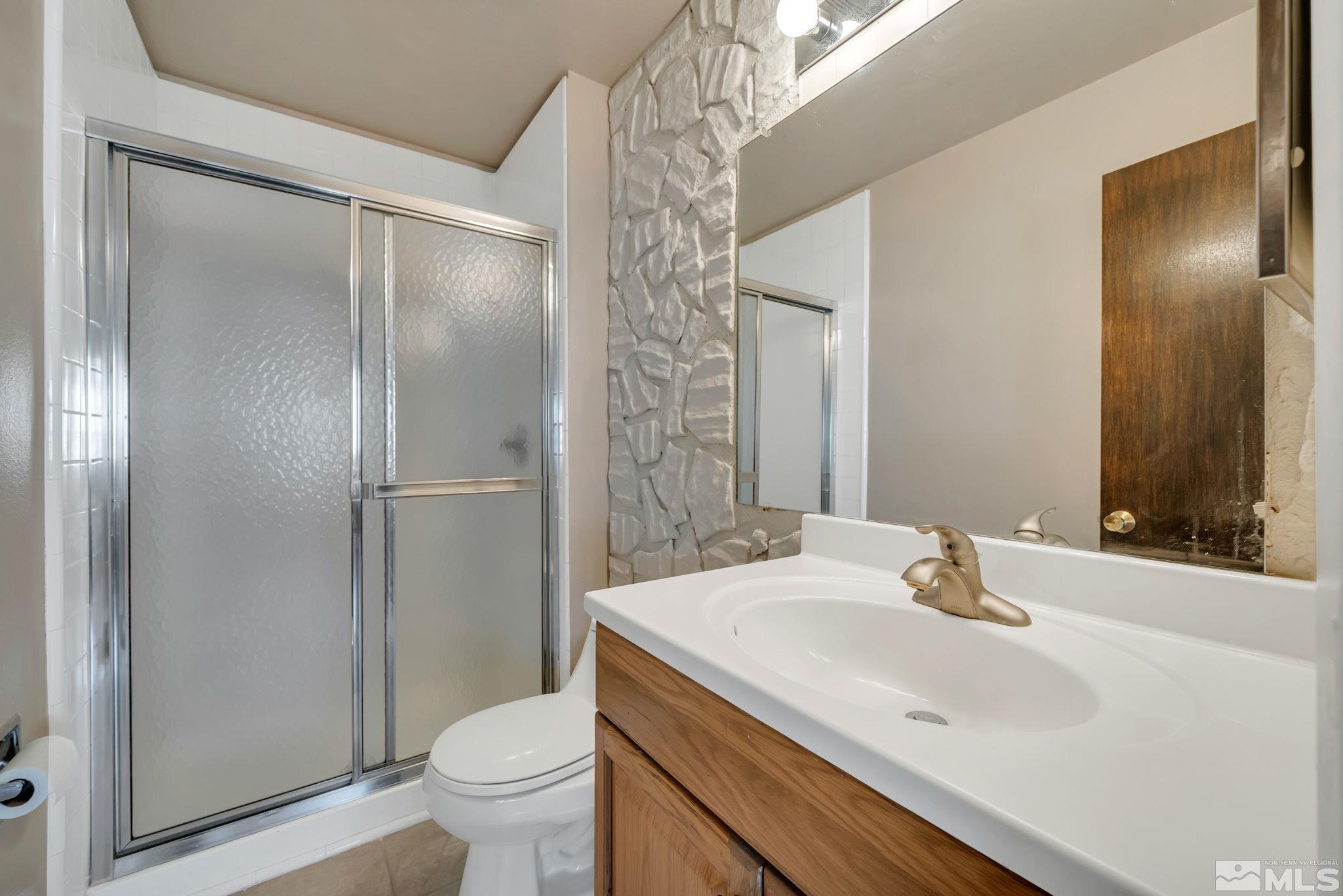 3240 Kings Row Reno, NV 89503 - Photo 14 of 31 a bathroom with a sink toilet and shower