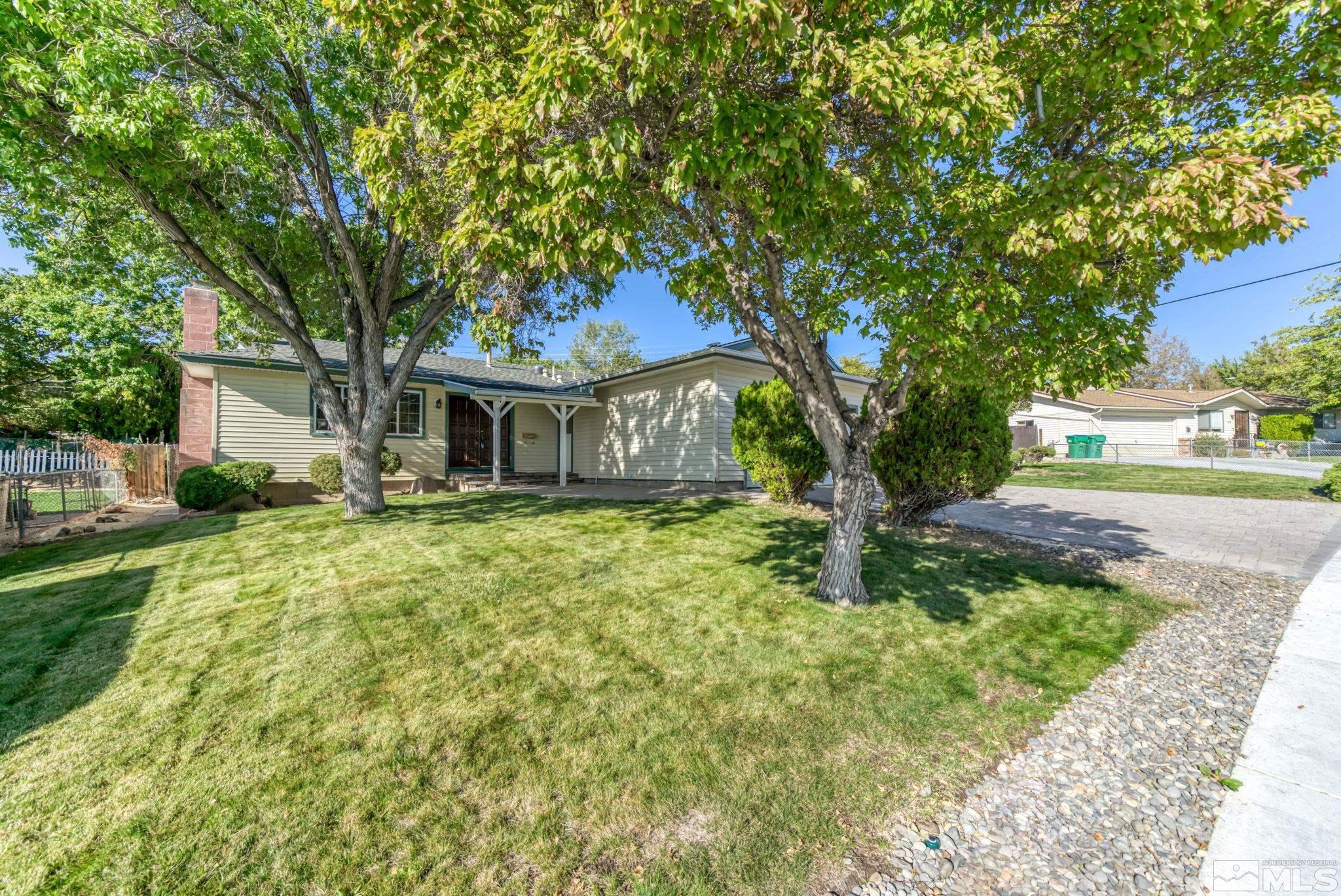 3240 Kings Row Reno, NV 89503 - Photo 3 of 31 a house with trees in front of it