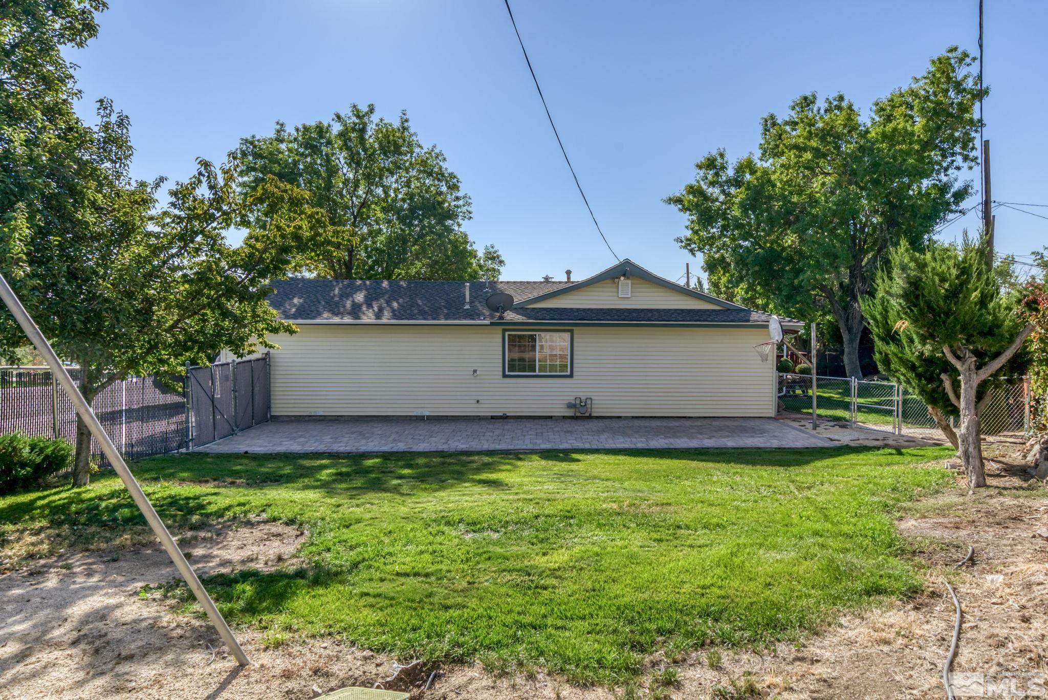 3240 Kings Row Reno, NV 89503 - Photo 31 of 31 a front view of a house with a yard and trees