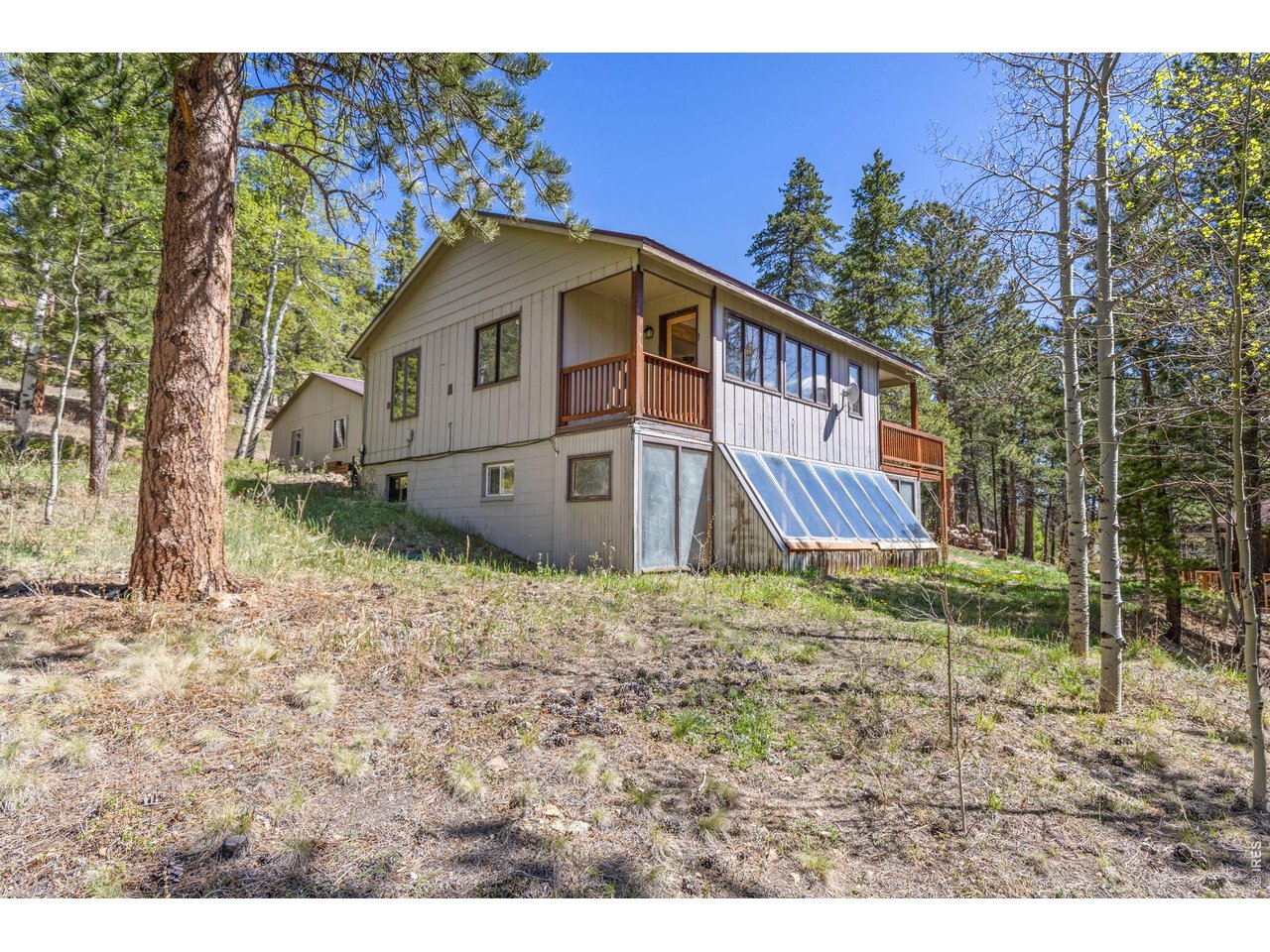 414 Upper Travis Gulch Road Black Hawk, CO 80422 - Photo 5 of 50 a house with trees in the background