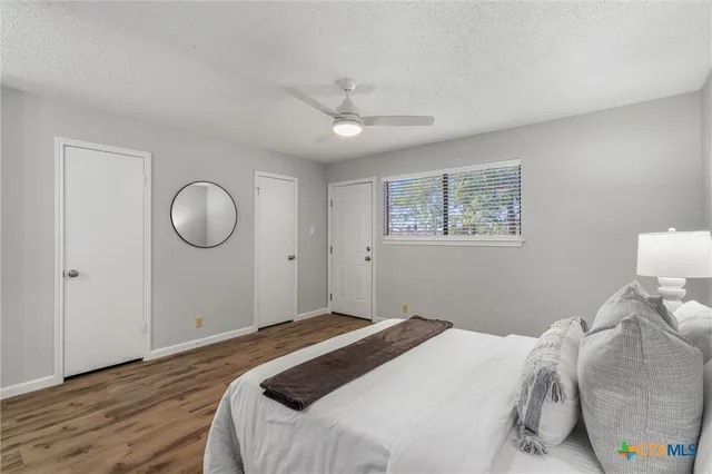 a bedroom with bed and a window