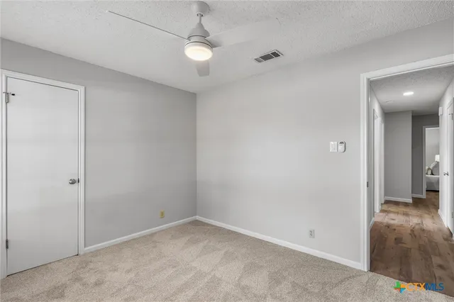 an empty room with a bathroom