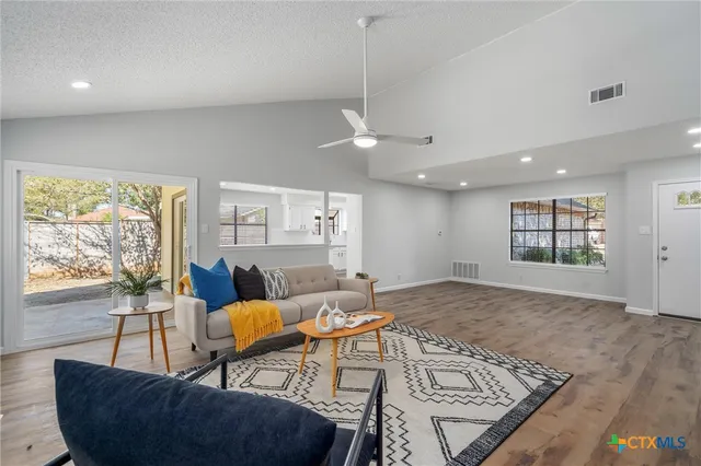 a living room with furniture and a window